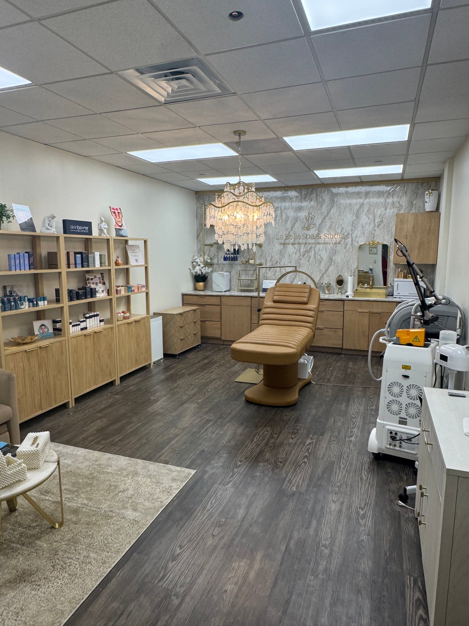 Salon suite interior with treatment chair and chandelier